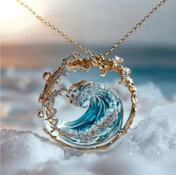 Colar feminino Évelia oceânico com pingente de onda azul em ouro e prata, joia elegante para presente.