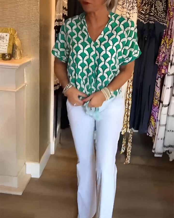Top feminino estampado casual, estilo versátil para o verão, cores vibrantes, ideal para moda confortável.