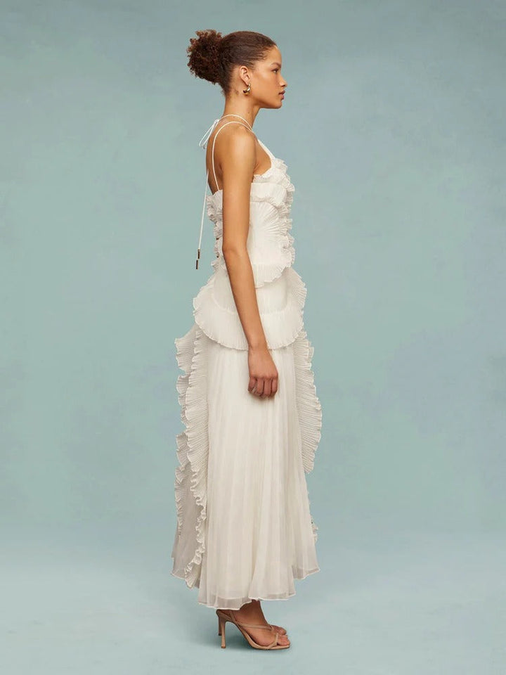 Vestido formal de festa com decote halter, babados e caimento longo impecável.