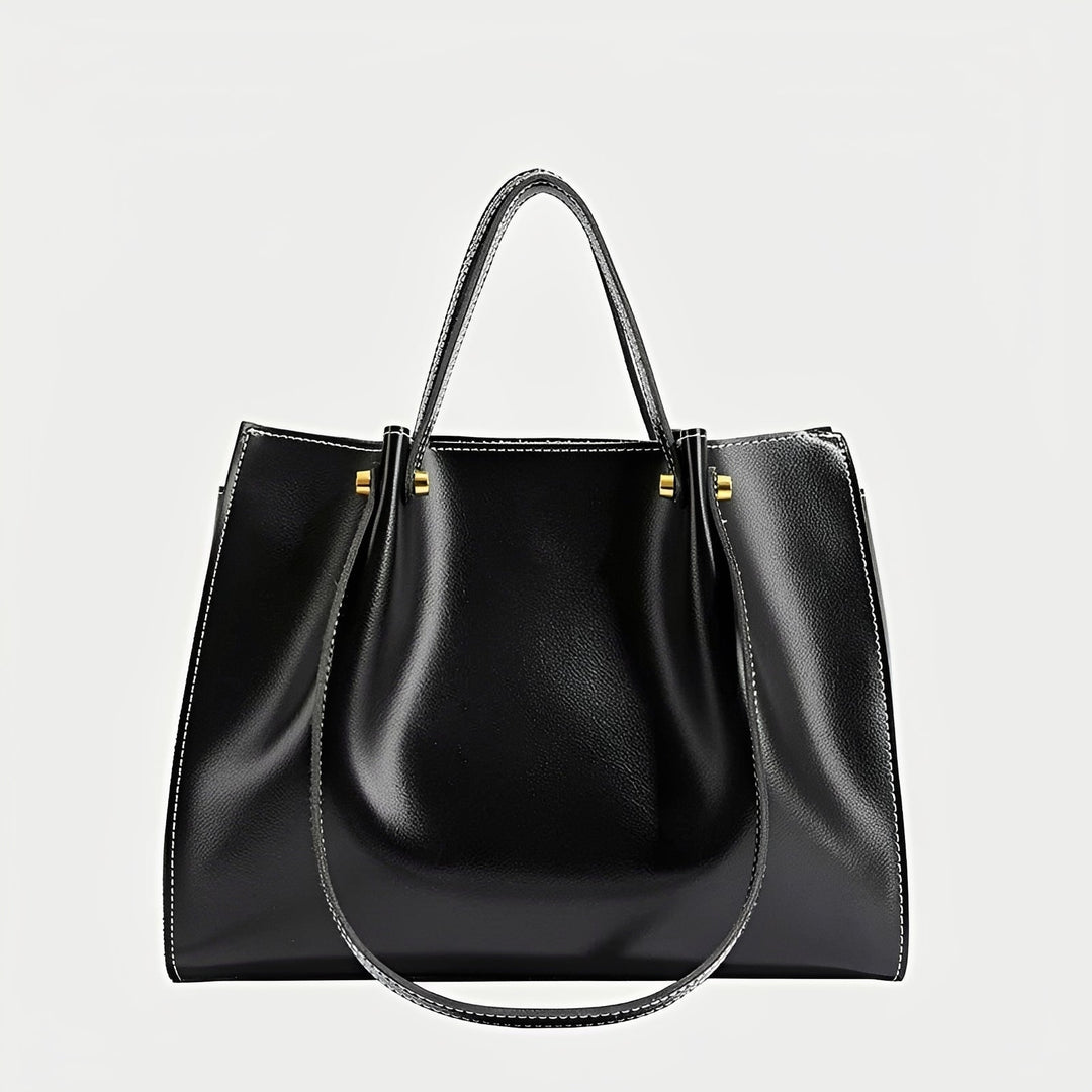 Bolsa de ombro Sabrina, um acessório feminino retrô chic. Disponível em marrom ou preto para um estilo clássico.