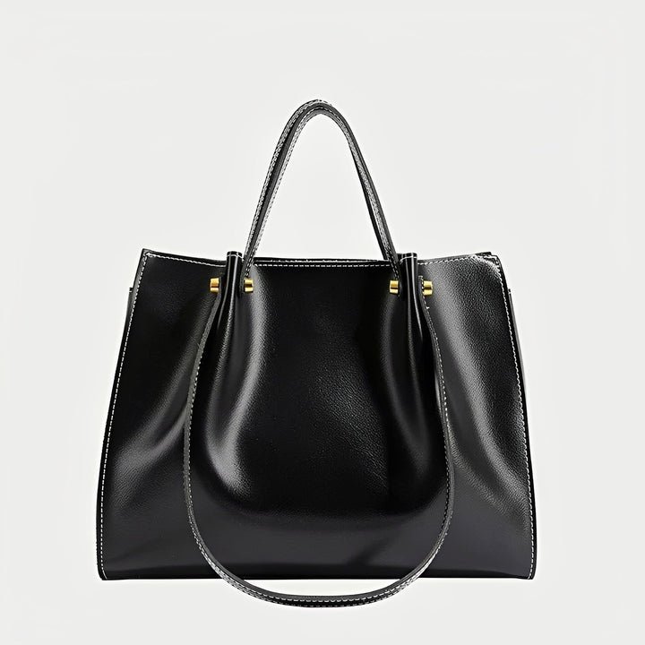 Bolsa de ombro Sabrina, um acessório feminino retrô chic. Disponível em marrom ou preto para um estilo clássico.