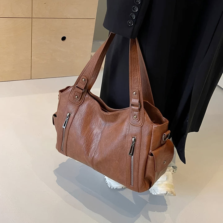 Bolsa de ombro feminina clássica preta, acessório elegante e versátil para o dia a dia. Estilo atemporal.