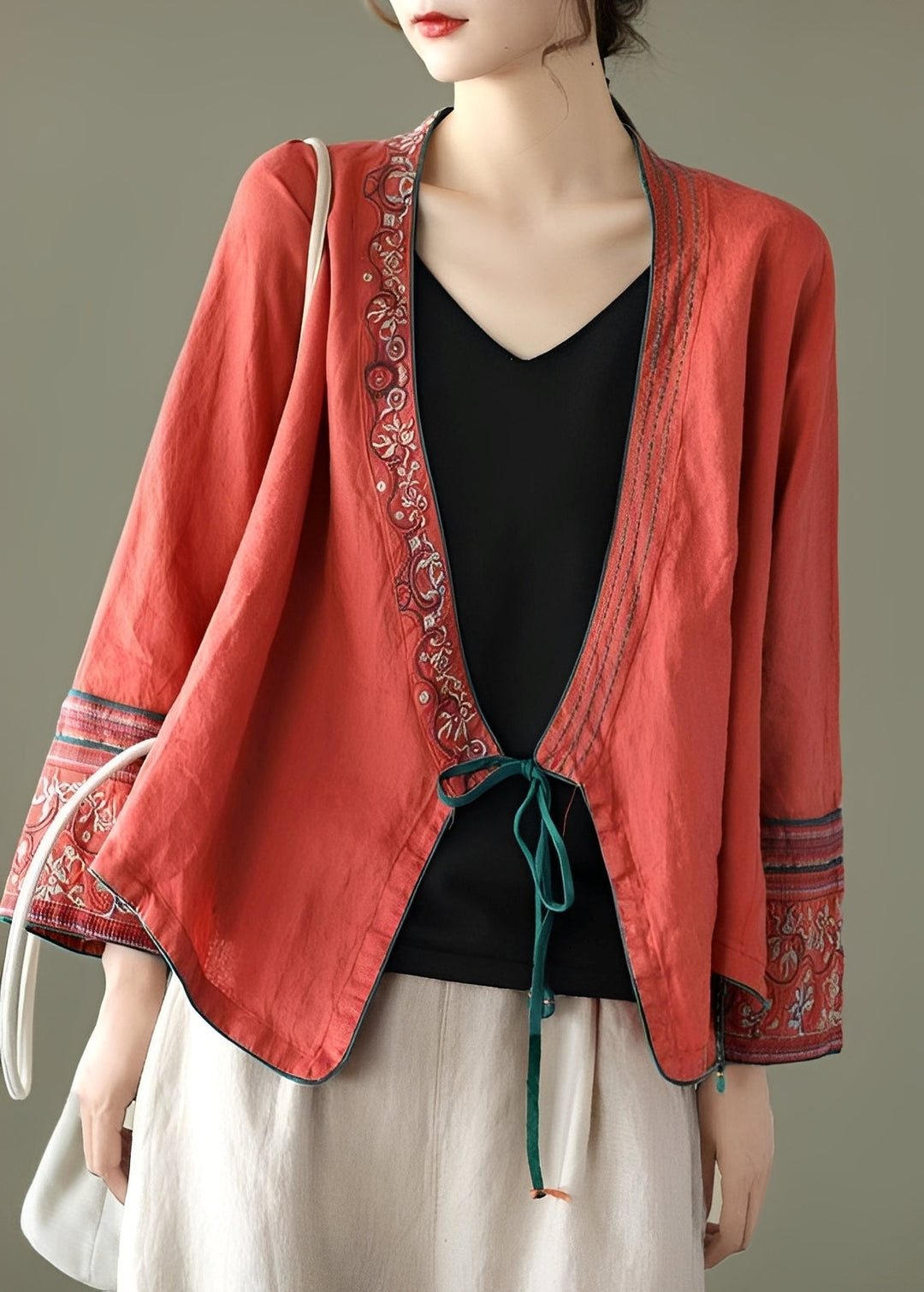 Blusa feminina versátil bordada, manga longa, estilo casual folgado. Roupa elegante e confortável para mulheres.