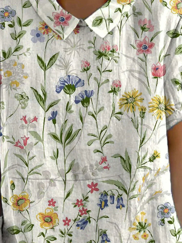 Blusa feminina floral retrô, ideal para moda casual. Confortável e versátil, estilo primavera-verão.