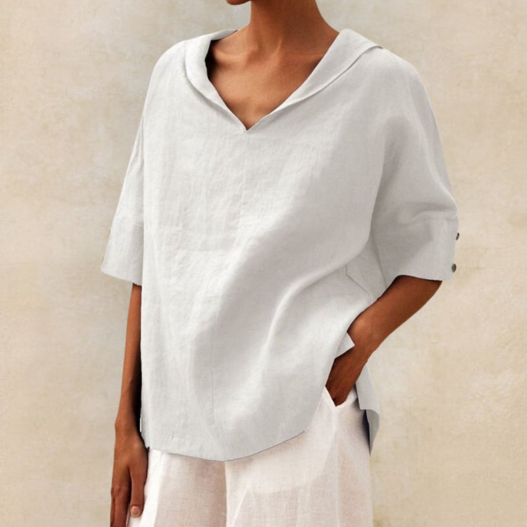 Silhueta fluida da blusa feminina gola V, corte leve e elegante. Conforto para a moda primavera verão.