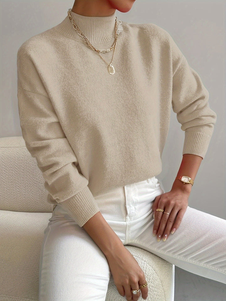 Sweater feminino de malha gola alta, design elegante e versátil, essencial para o outono/inverno.