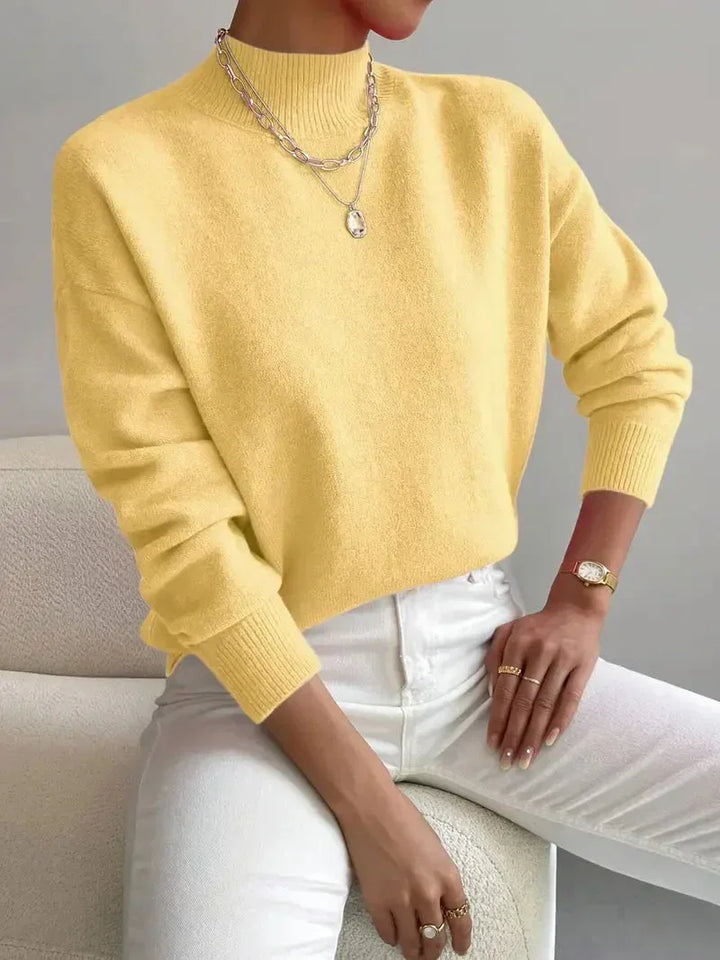Textura da malha do sweater feminino Yvonne, gola alta macia e confortável, moda inverno.