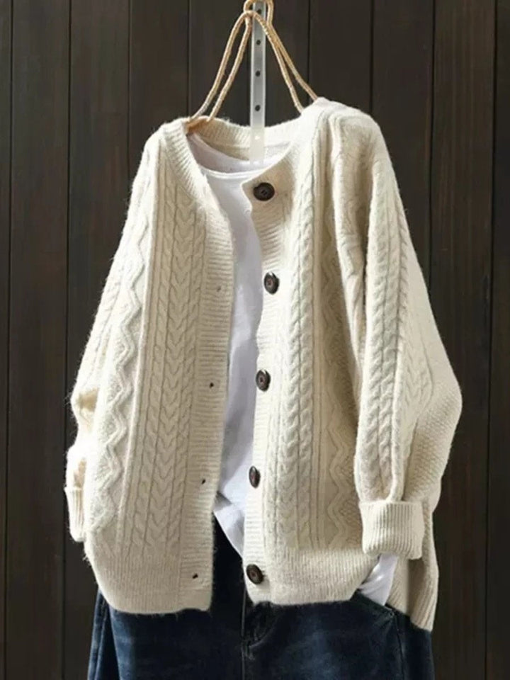 Casaco de malha trança feminino oversized com botões, ideal para outono/inverno. Conforto e estilo.