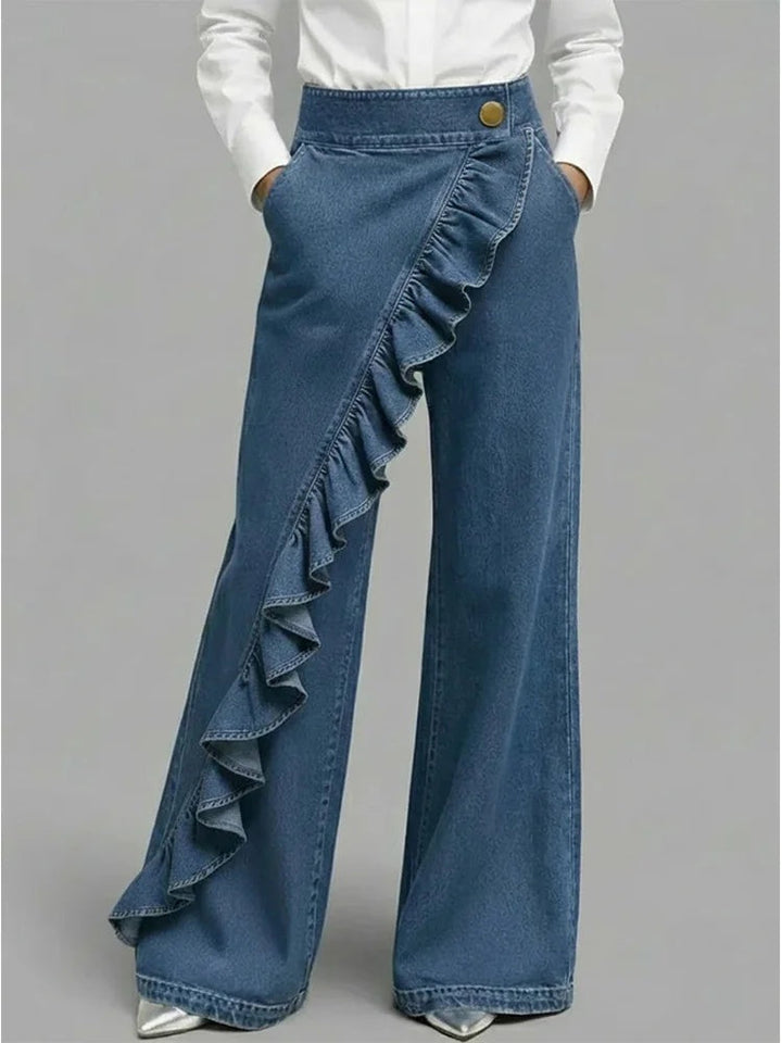 Jeans perna larga mulher, cintura alta com folhos, ideal para um estilo casual e moderno.