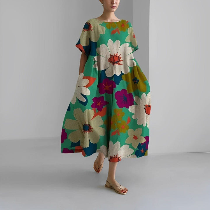 Tendência feminina: Vestido maxi floral boho, perfeito para a primavera e o verão. Estampado, solto e muito confortável.