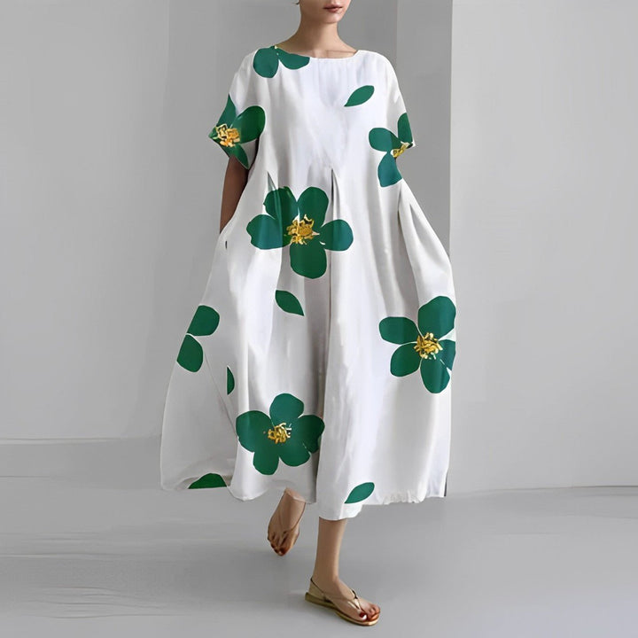 Vestido maxi feminino com estampa floral boho, perfeito para dias de primavera e verão. Conforto e estilo casual.