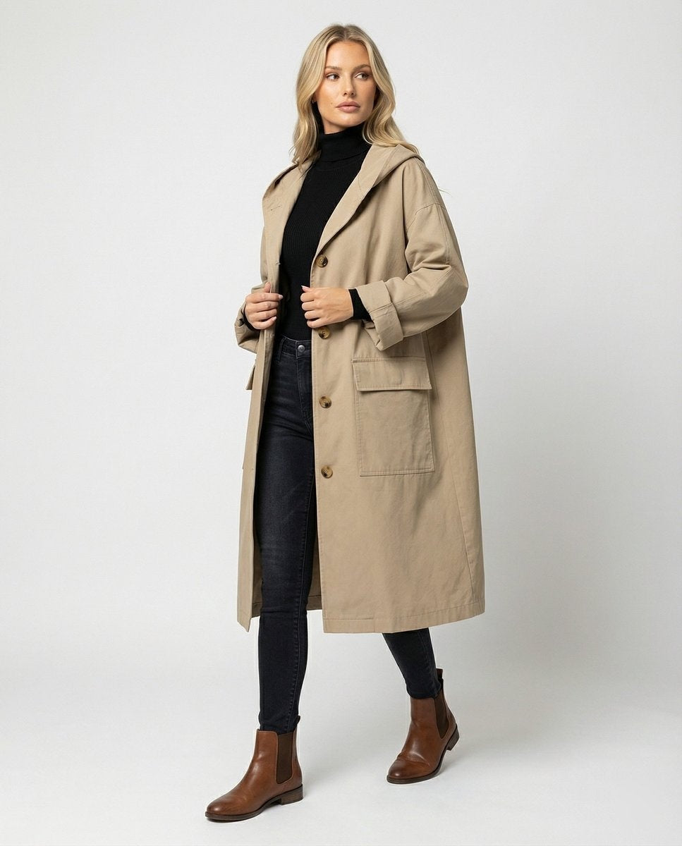 Gabardina impermeável comprida para mulher com capuz, ideal para outono e inverno com estilo e proteção.