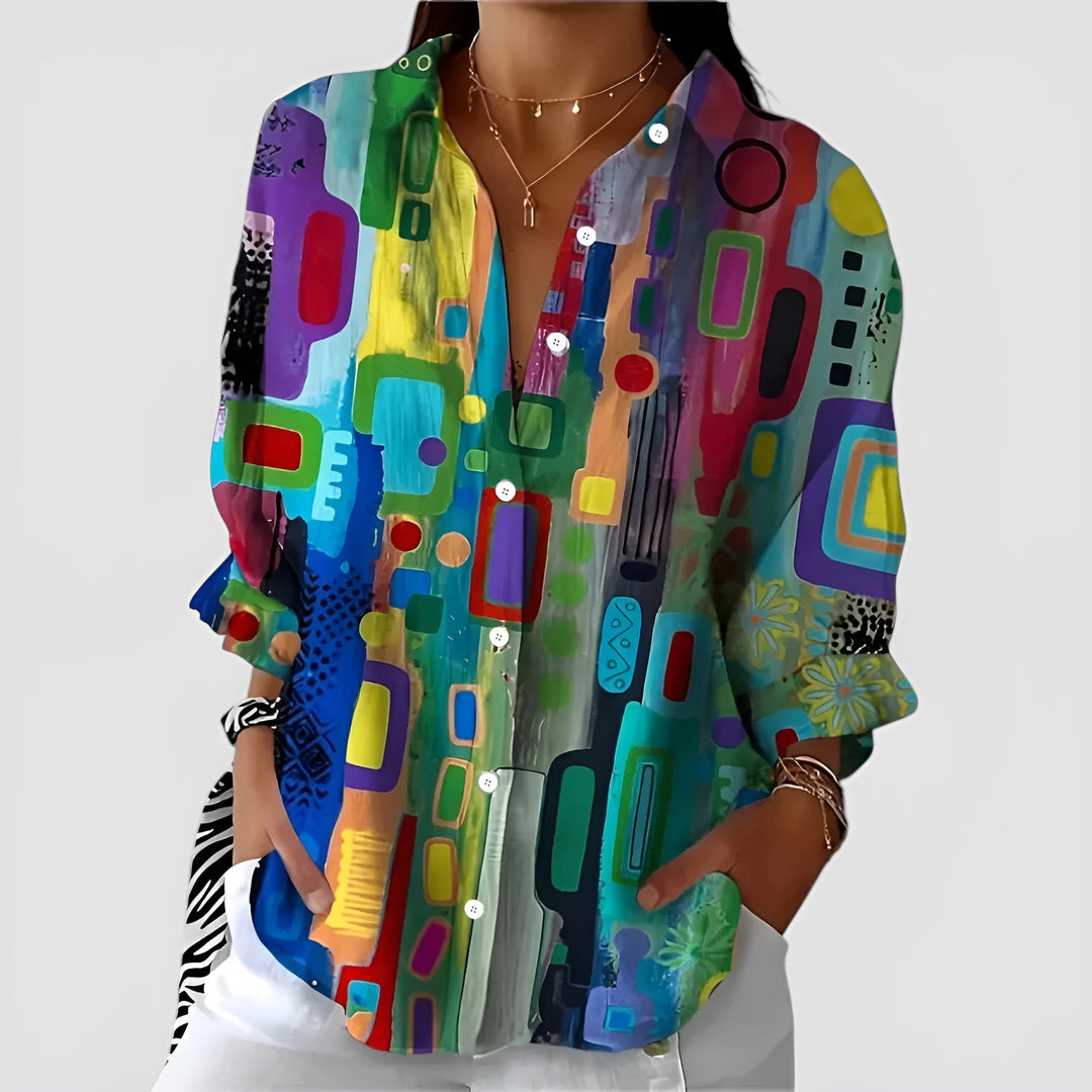 Blusa feminina elegante com estampa geométrica moderna. Perfeita para um look casual chic e confortável no dia a dia.