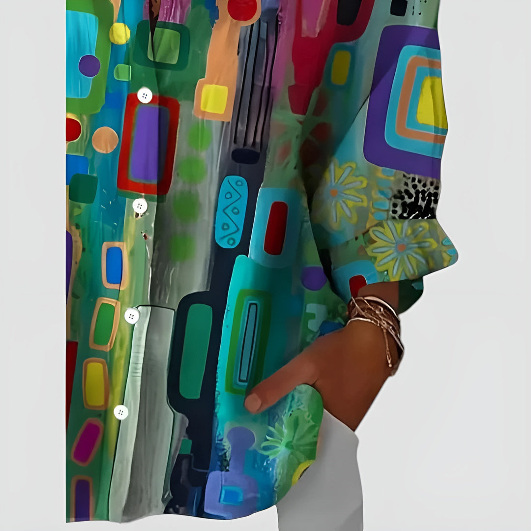 Blusa feminina de manga longa com estampa geométrica vibrante. Estilo moderno para moda casual e conforto diário.