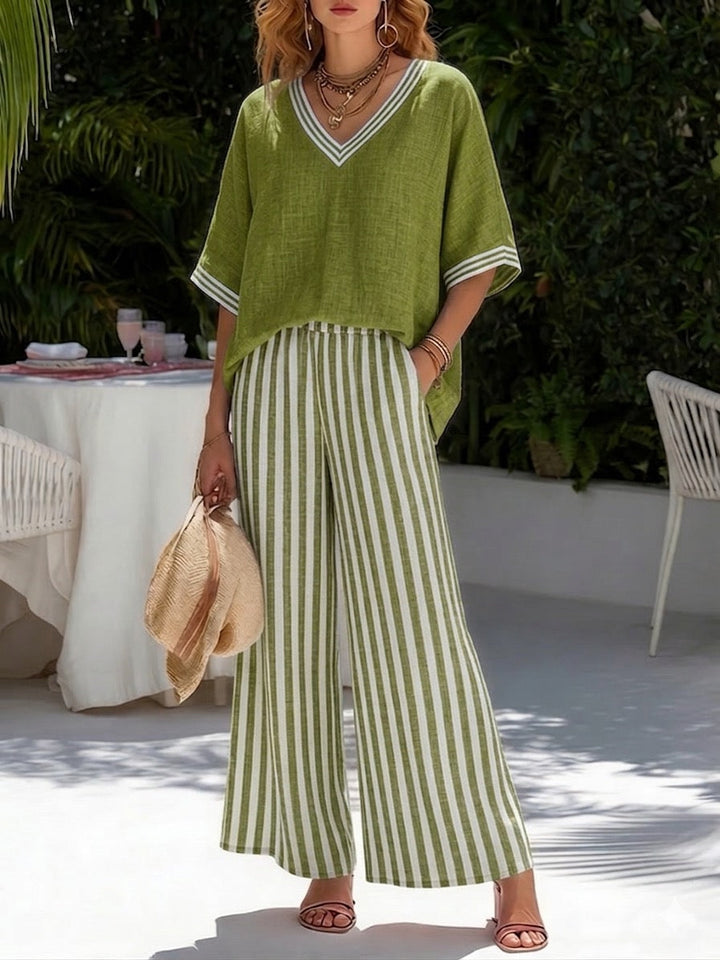 Mulher estilosa vestindo conjunto feminino de linho riscado, casual e elegante para dias quentes.