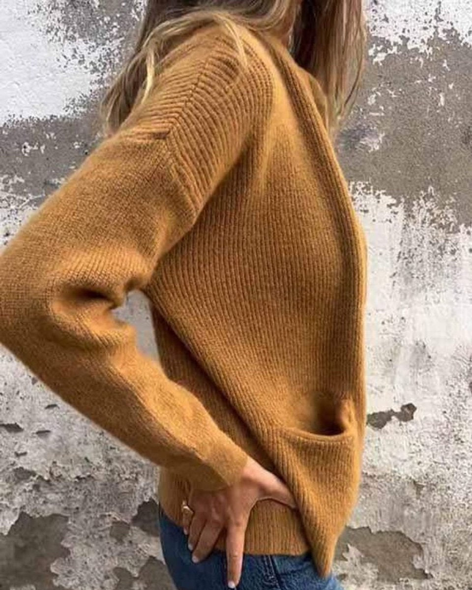 Casaco de malha canelado de outono/inverno para mulher, com fecho e bolsos. Oferece máximo conforto e estilo.