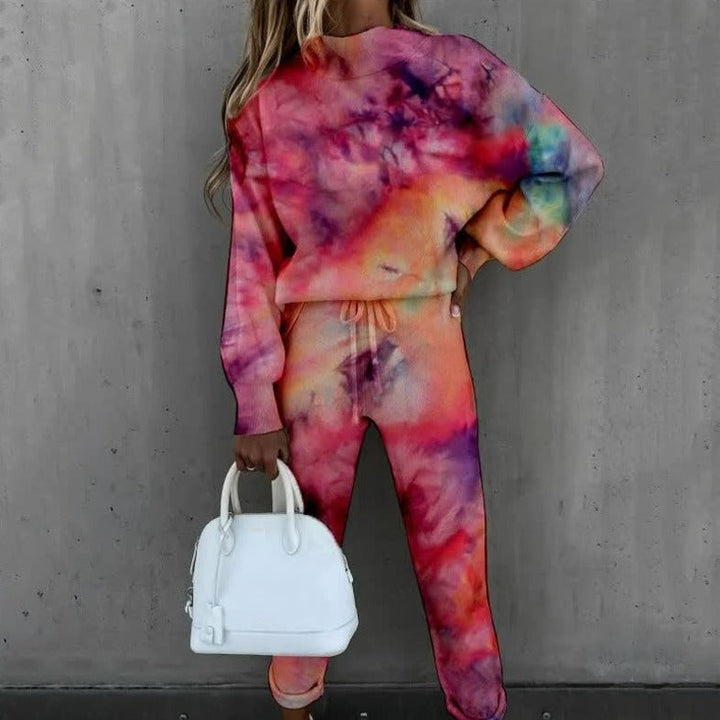 Conjunto feminino estampado de malha, com sweatshirt e calças, para conforto e estilo casual na moda descontraída.