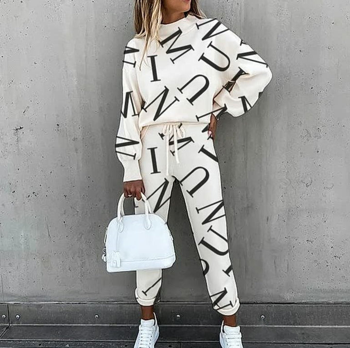 Sweatshirt feminina estampada e calças casuais de malha, um conjunto coordenado para máximo conforto no dia a dia.