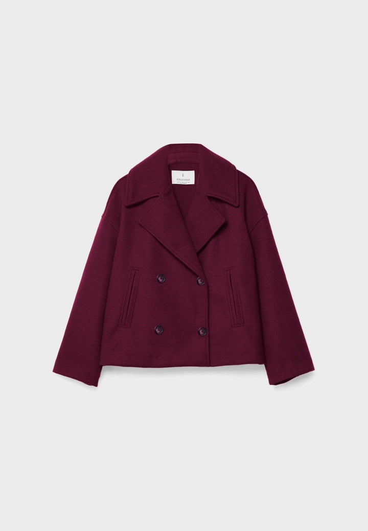 Blazer feminino de alfaiataria com fechamento cruzado, adicionando sofisticação ao guarda-roupa social.