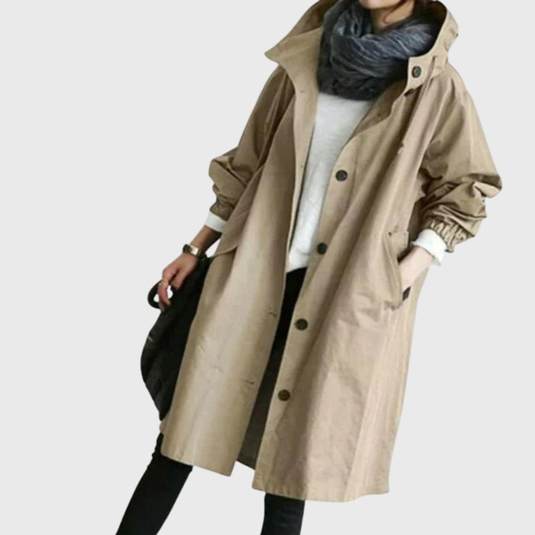 Versátil gabardina comprida feminina impermeável com capuz e corte largo, casaco essencial de outono/inverno.