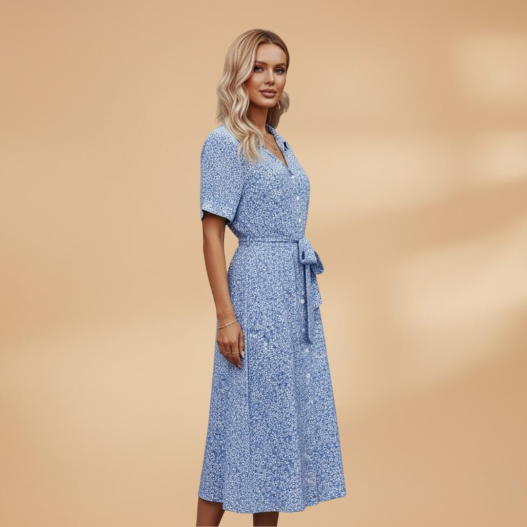 Vestido midi estampado floral vibrante, corte camiseiro feminino com decote V. Ideal para mulher moderna.
