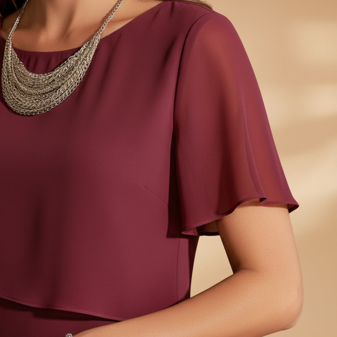 Vestido Midi feminino elegante, manga curta, com design versátil. Ideal para festas e ocasiões especiais.