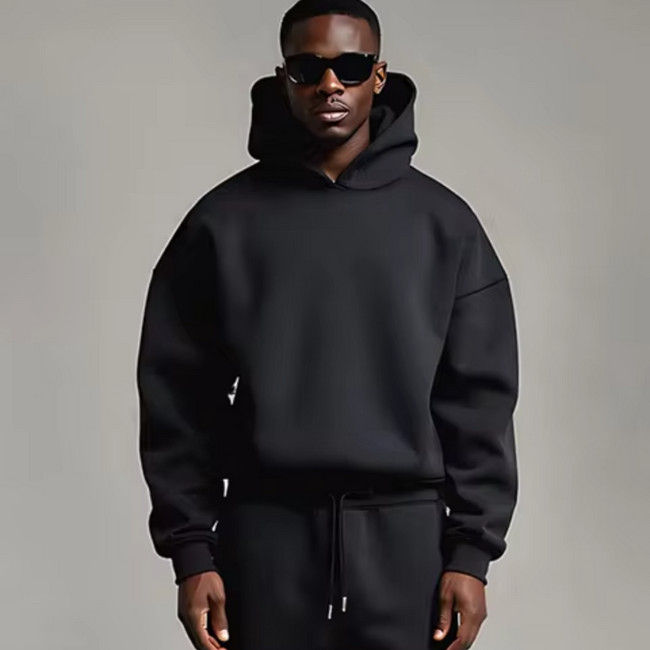 Conjunto desportivo masculino oversize com capuz, hoodie e calças, ideal para conforto casual e estilo streetwear.
