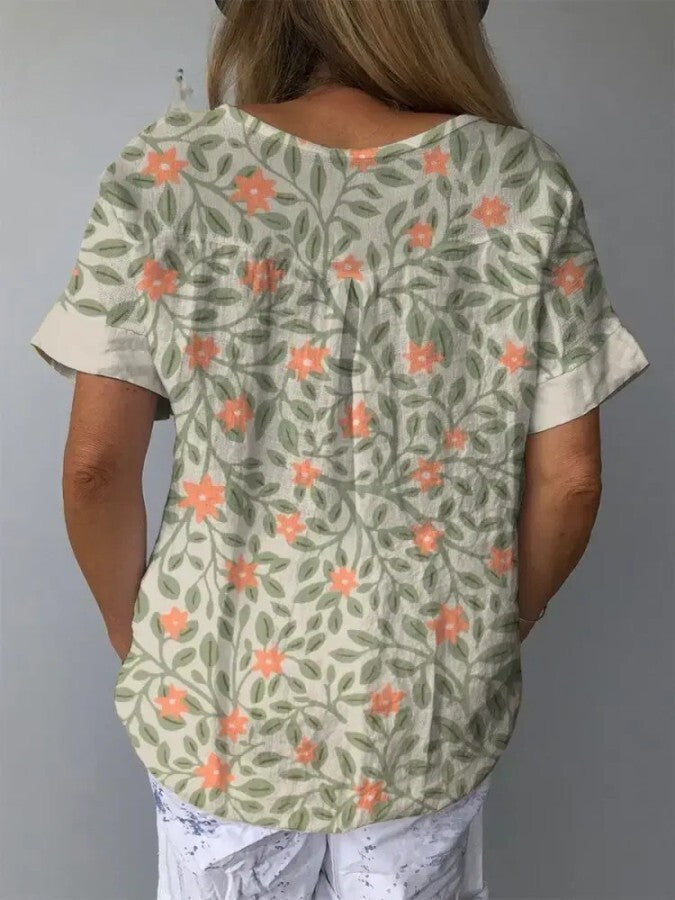 Estilosa camisa feminina casual verde claro com estampa floral vibrante, perfeita para o verão e moda feminina confortável.
