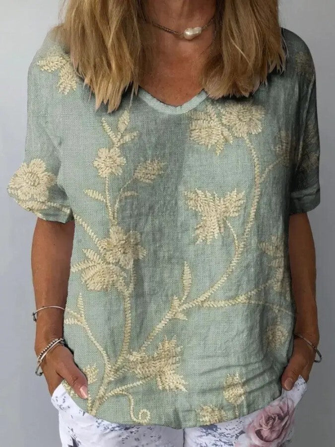 Camisa feminina casual de verão com estampa floral retrô vibrante, ideal para dias quentes, leve e confortável.